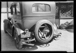 Rear view of Studebaker showing broken bumper, Southern California, 1931