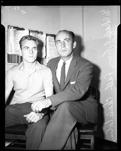 Murder suspect with father, 1957