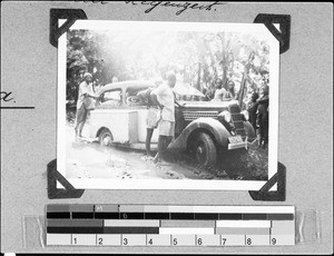 Men standing beside a car, Nyasa, Tanzania, 1937
