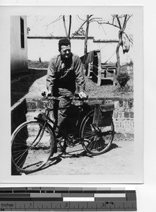Rev. Lloyd Glass, MM and his bicycle at Guilin, China, 1947