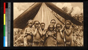 Young girls standing outside a tent, Angola, ca.1920-1940