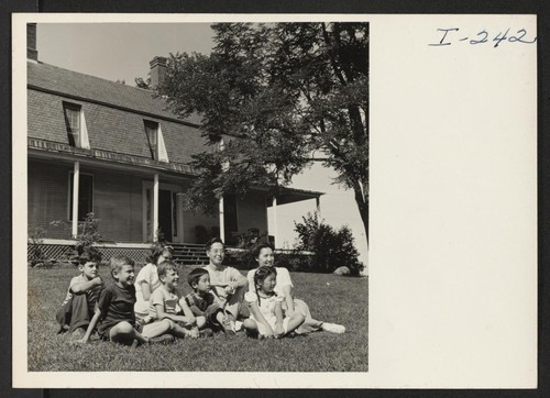 Soze and Mitsue Ito and their children, Diane and Joel, and Caucasian friends at the Putney School, Putney, Vermont. Itos came from the Gila River Center. Photographer: Iwasaki, Hikaru Putney, Vermont