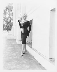 Black pencil dress modeled outside the Sonoma County Courthouse, Santa Rosa, California, 1959