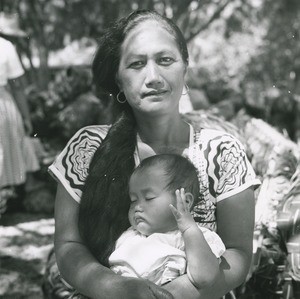Portrait of a Polynesian woman with a baby