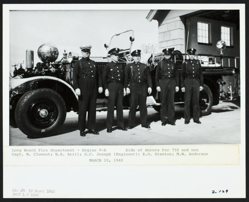 Crew standing alongside Engine 9-A in front of Station No. 9, 3917 Long Beach Blvd
