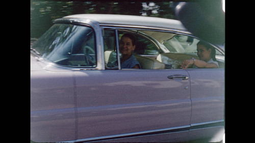 Still from Parker Home Movie: Parker's wife Ann and daughter Ann Parker in lavender Lincoln Premiere