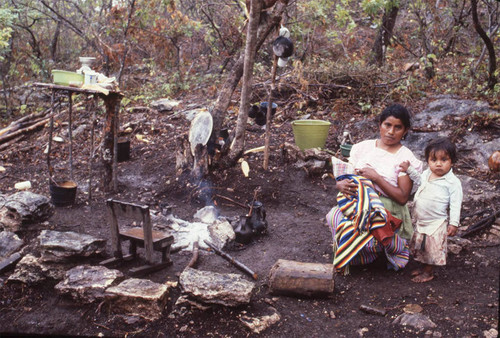 Guatemalan refugee breastfeeds a baby, La Sombra, 1983