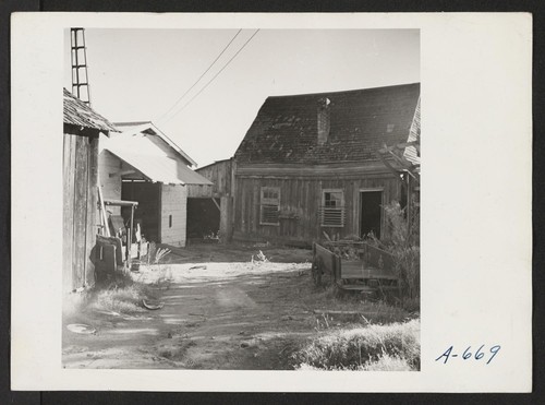 Buildings and views of ranch formerly owned and operated by farmer of Japanese ancestry. The soil in this area is very shallow with many large rocks. The ranch raises fruit but is now deserted. Photographer: Stewart, Francis Penryn, California