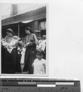 Maryknoll Sisters with infants at Dalian, China