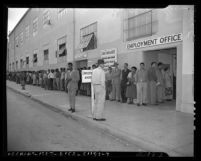 Line people waiting outside aircraft industry employment office in Los Angeles, 1950