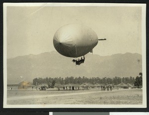 Large airship being held down by men, perhaps at a military "balloon school" in Arcadia, ca.1915