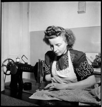 [Connie Lautze: woman at sewing machine]