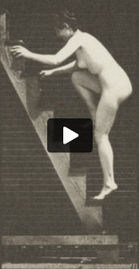 Nude woman turning ascending a stepladder