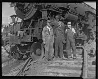Locomotive engineers and firemen at railroad crash site, Glendale, 1935