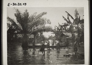 Pupils going to school in Wuri by raft during the rainy season