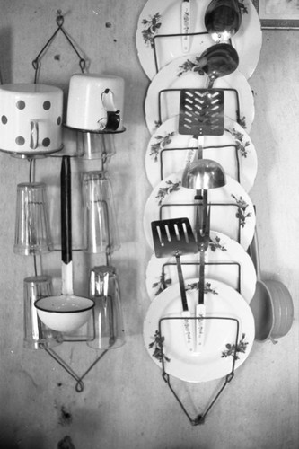Kitchen utensils hanging from a wall, San Basilio de Palenque, 1976