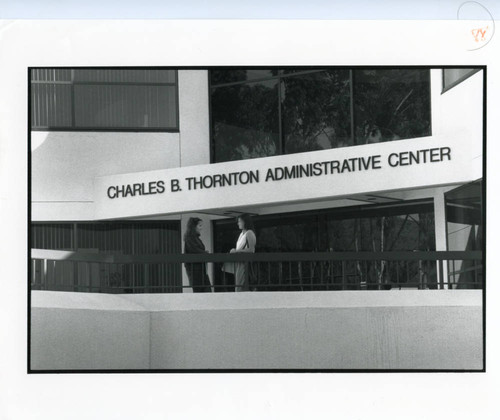 Students at the lower entrance to the Charles B. Thornton Administrative Center