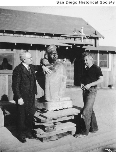 Sculptor Donal Hord and Holger Cahill of the Federal Art Project posing with Hord's The Aztec at his Pacific Beach studio