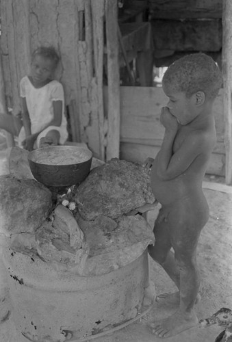 Child standing next to stove, San Basilio de Palenque, ca. 1978