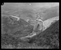 Distant view of remaining center portion of the St. Francis Dam visible after its disastrous collapse, San Francisquito Canyon (Calif.), 1928
