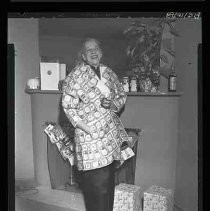 Unknown man in coat covered with dollar bills