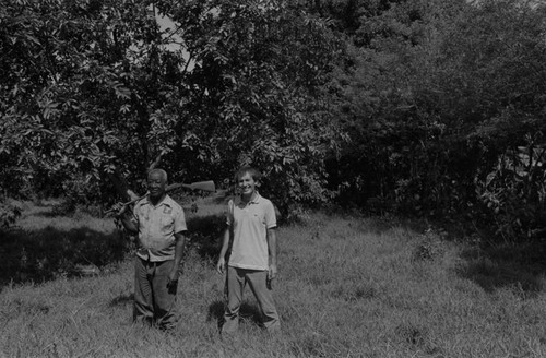 Fermín Herrera and Richard Cross posing together near the woods, San Basilio de Palenque, ca. 1978