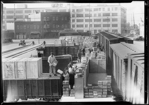 Unloading radios from train, Southern California, 1928