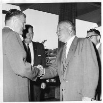 Edward A. Combatalade greets Postmaster General, Arthur E. Summerfield, and as they gather to commemorate the centennial of the Pony Express in 1960. Sacramento Postmaster, Kenneth Hammaker is in the center