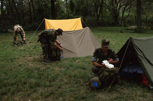 Survival school students near tents, Liberal, 1982