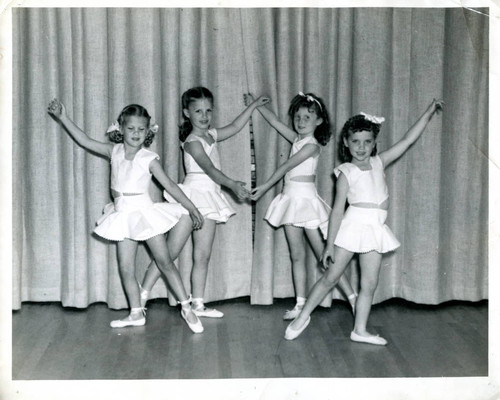 Four ballerinas on stage