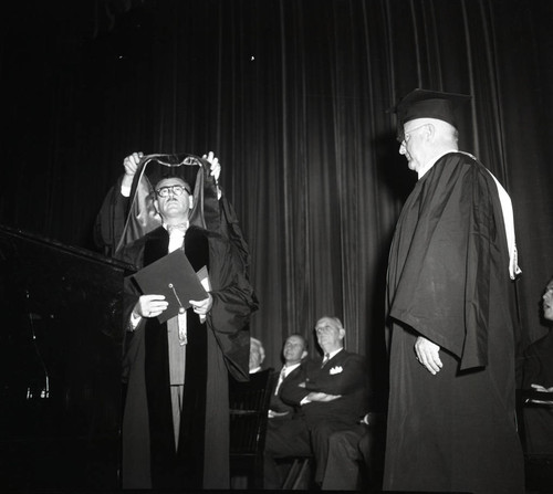 President Hugh Tiner bestowing a doctorate