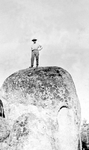 Man standing on top of large granite rock at Ramsey Bar