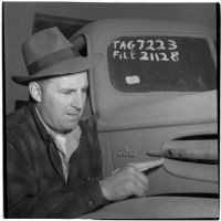 F.W. Fetherston examines a truck that is for sale at the War Assets Administration's surplus sale, Port Hueneme, May 1946