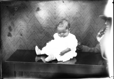 Portrait of baby sitting on bench