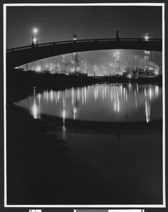 Night view of oil wells in Wilmington, ca.1930