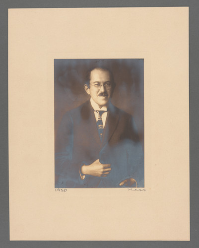 [Portrait of Otto Stern holding the front of his suit jacket.]