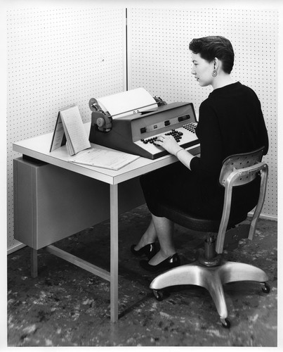 Woman Transcribing Data into a Desktop IBM Data Processing Machine