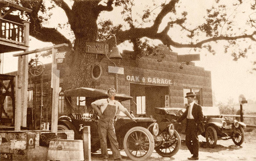 Charles Cooper standing next to his Calabasas Grocery Store and the Oak Garage, 1910s