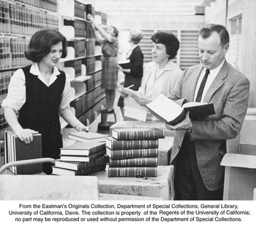 King Hall, Law Library in temporary building, first shipment of new books. Pat Piper, Betty Wiliams, Beverly Abbott, Phebe Bandy Fraser, Mortimer D. Sscwartz (left to right)