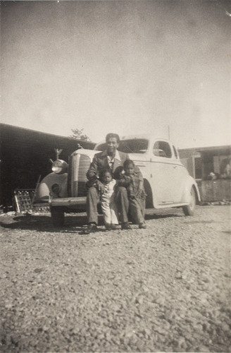 Soriano Family with their '41 Chevrolet at the Briggs Labor Camp in Santa Paula, CA