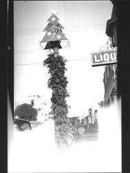 Light pole topped by a Christmas tree in downtown Petaluma, California, about 1930
