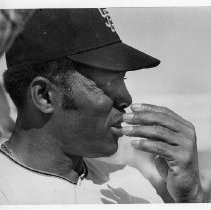 Willie Mays in a San Francisco Giants uniform, looking thoughtful