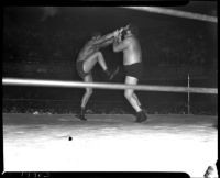 Sandor Szabo and "Big Ben" Morgan wrestle in downtown Los Angeles. June 30, 1937