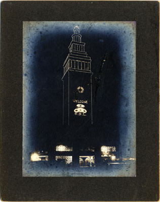 [View of Ferry Building at night with decorative lighting]