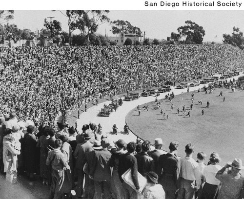 People gathered in Balboa Stadium watching President Franklin Roosevelt's motorcade