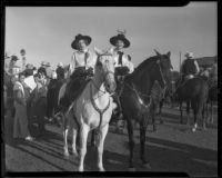 Two women on horseback at a horse show, Anaheim, 1935
