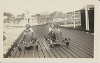 Two children riding Boardwalk cars