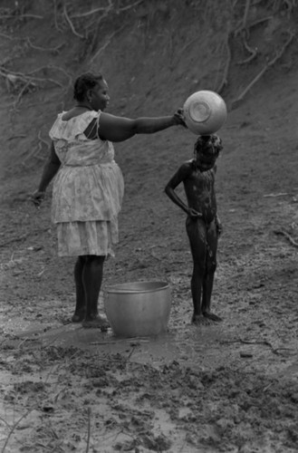 Woman bathing a child, San Basilio de Palenque, Colombia, 1977