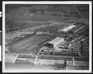 Panoramic view of the Los Angeles County Fair, showing a runner's track at center, 1936