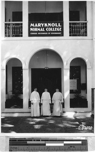 Three Maryknoll Sisters standing in front of entrance to Maryknoll Normal School, Manila, Philippines, June 19, 1936
